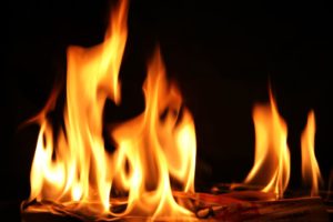 a roaring fire inside a fireplace