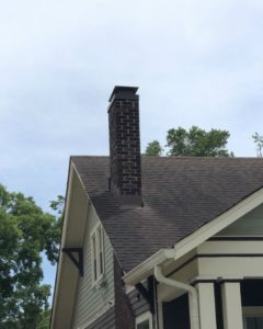 brick chimney on  a white house
