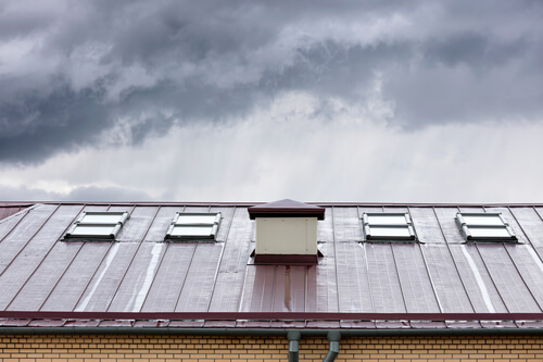 rainy skies over a red roof with chimney - Elkton MD - Ace Chimney Sweeps rainy skies over a red roof with chimney - Elkton MD - Ace Chimney Sweeps